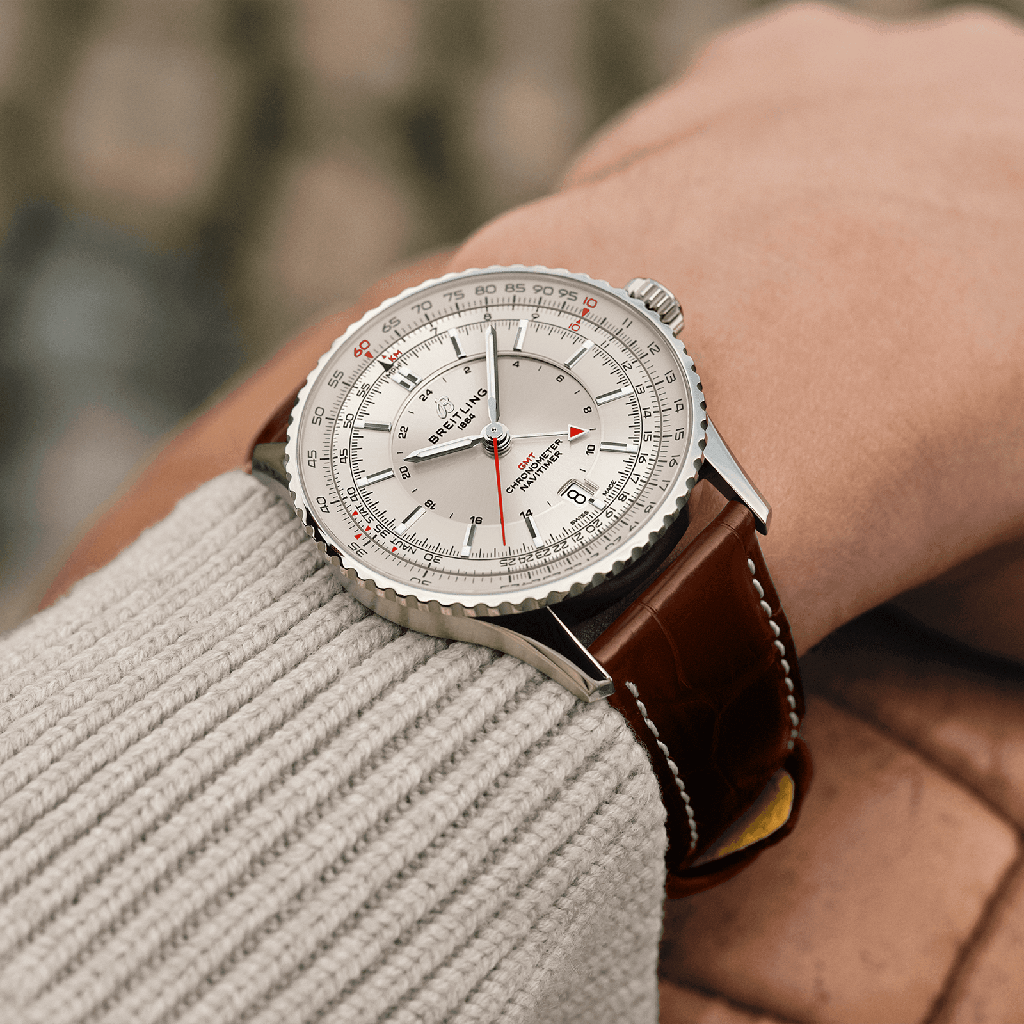 navitimer-41-gmt-a32310211g1p1-white-leather-wrist-shot-ecom_fc3bf990-701f-4a7b-b7f6-40a69c003798.png